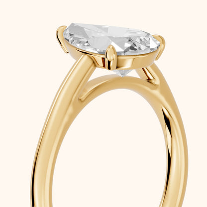 Sadie Cathedral Solitaire Pear Diamond Ring in Yellow Gold - slant-view.webp