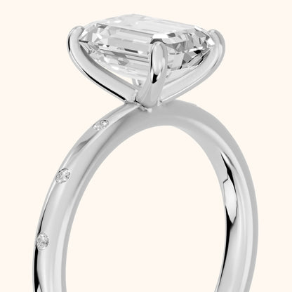 Dulcie Flush-Set Emerald Diamond Engagement Ring in White Gold - slant-view.webp