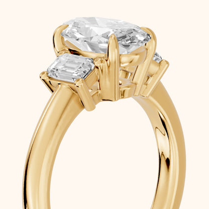 Babette Deco Three-Stone Oval Diamond Engagement Ring in Yellow Gold - slant-view.webp
