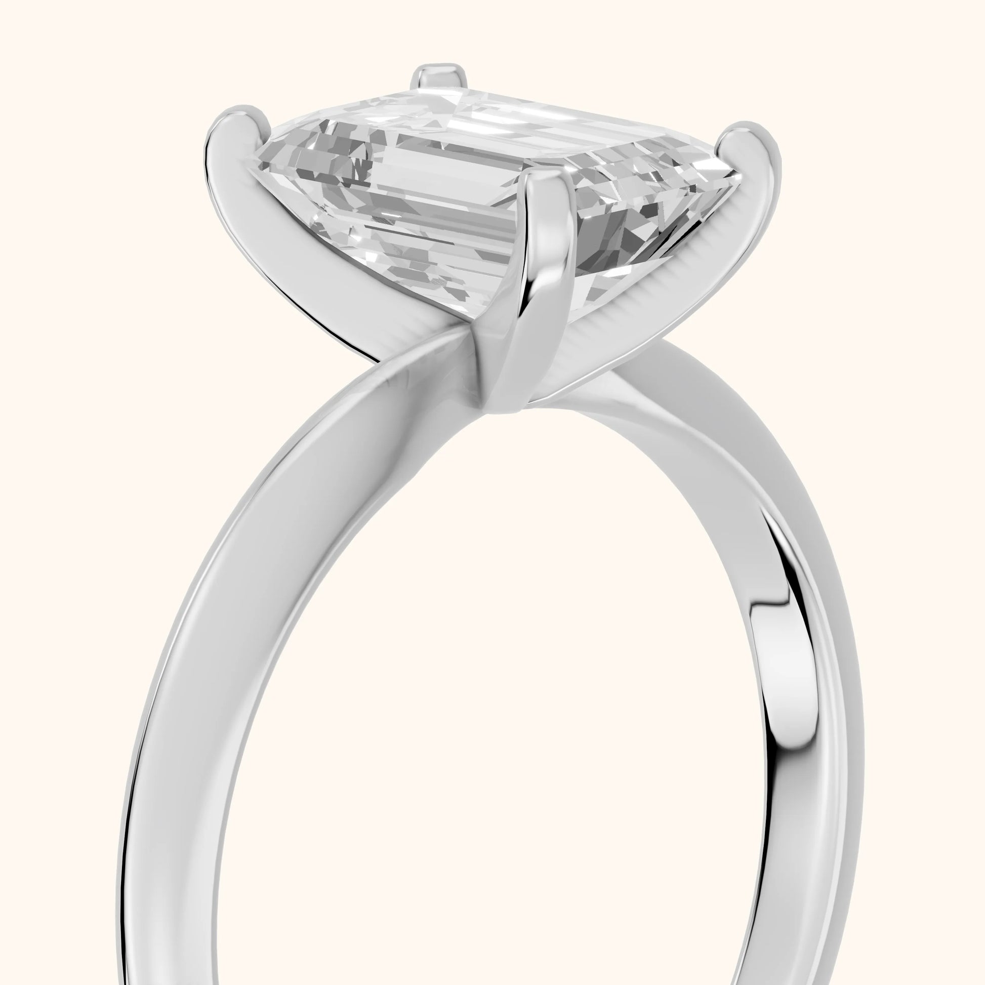 Wren Solitaire Emerald Diamond Ring in Platinum - slant-view.webp