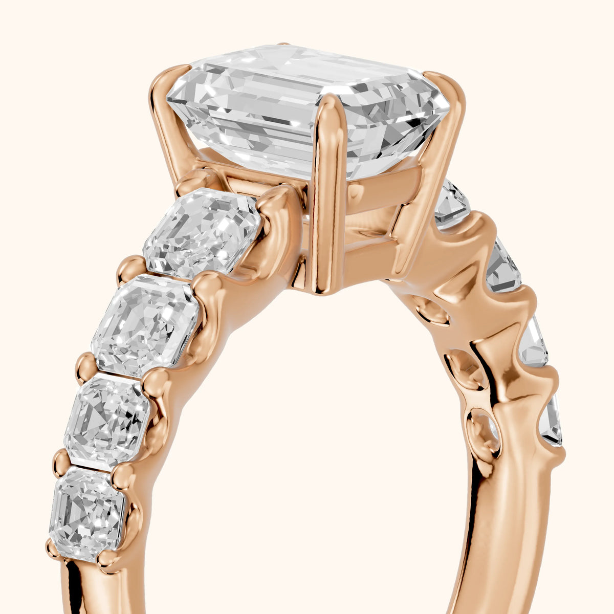Sonja Graduated Pavé Emerald Diamond Engagement Ring in Rose Gold - slant-view.webp
