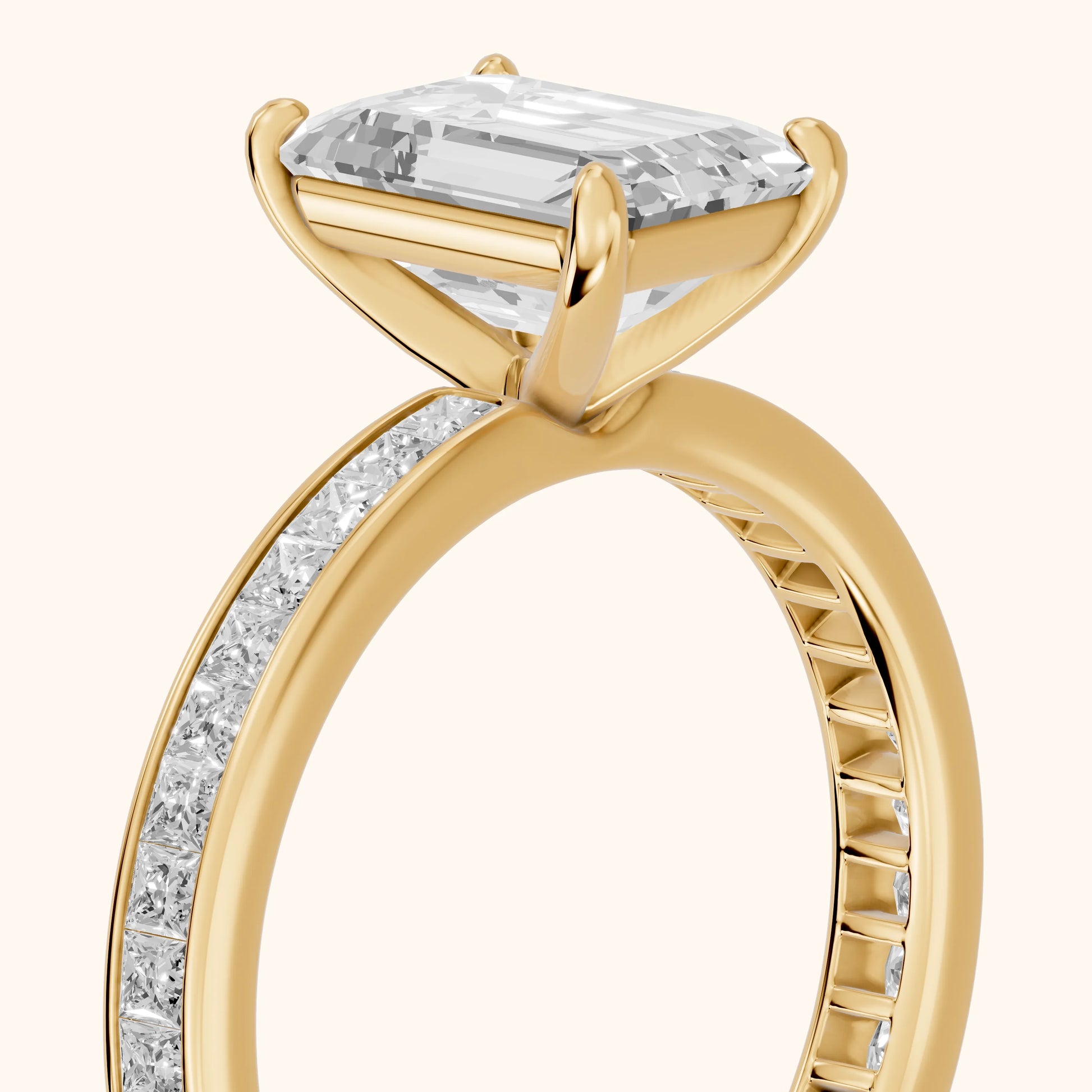 Brielle Channel Set Solitaire Emerald Diamond Ring in Yellow Gold - slant-view.webp