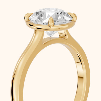 Ashland Basket Solitaire Round Diamond Engagement Ring in Yellow Gold - slant-view.webp