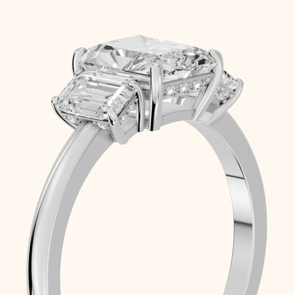 Marian Three-Stone Hidden Halo Radiant Diamond Engagement Ring in White Gold - slant-view.webp