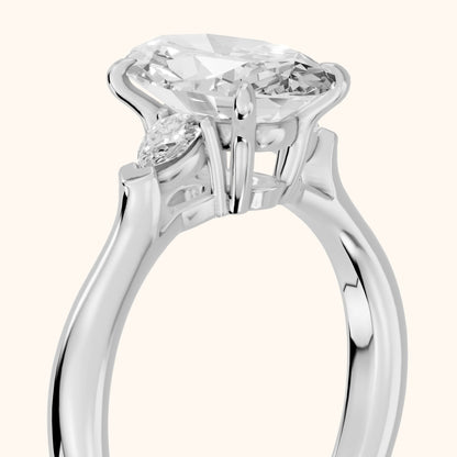 Dahlia Three-Stone Cathedral Oval Diamond Engagement Ring in Platinum - slant-view.webp