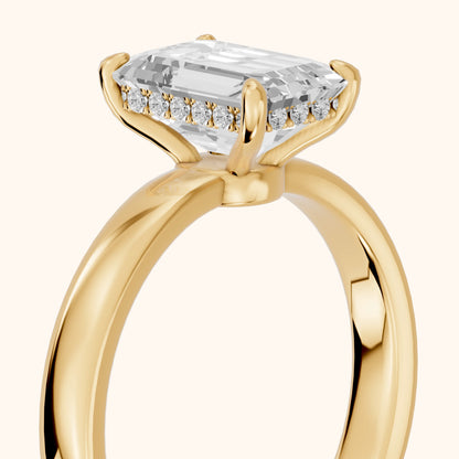 Lara Hidden Halo Emerald Diamond Engagement Ring in Yellow Gold - slant-view.webp