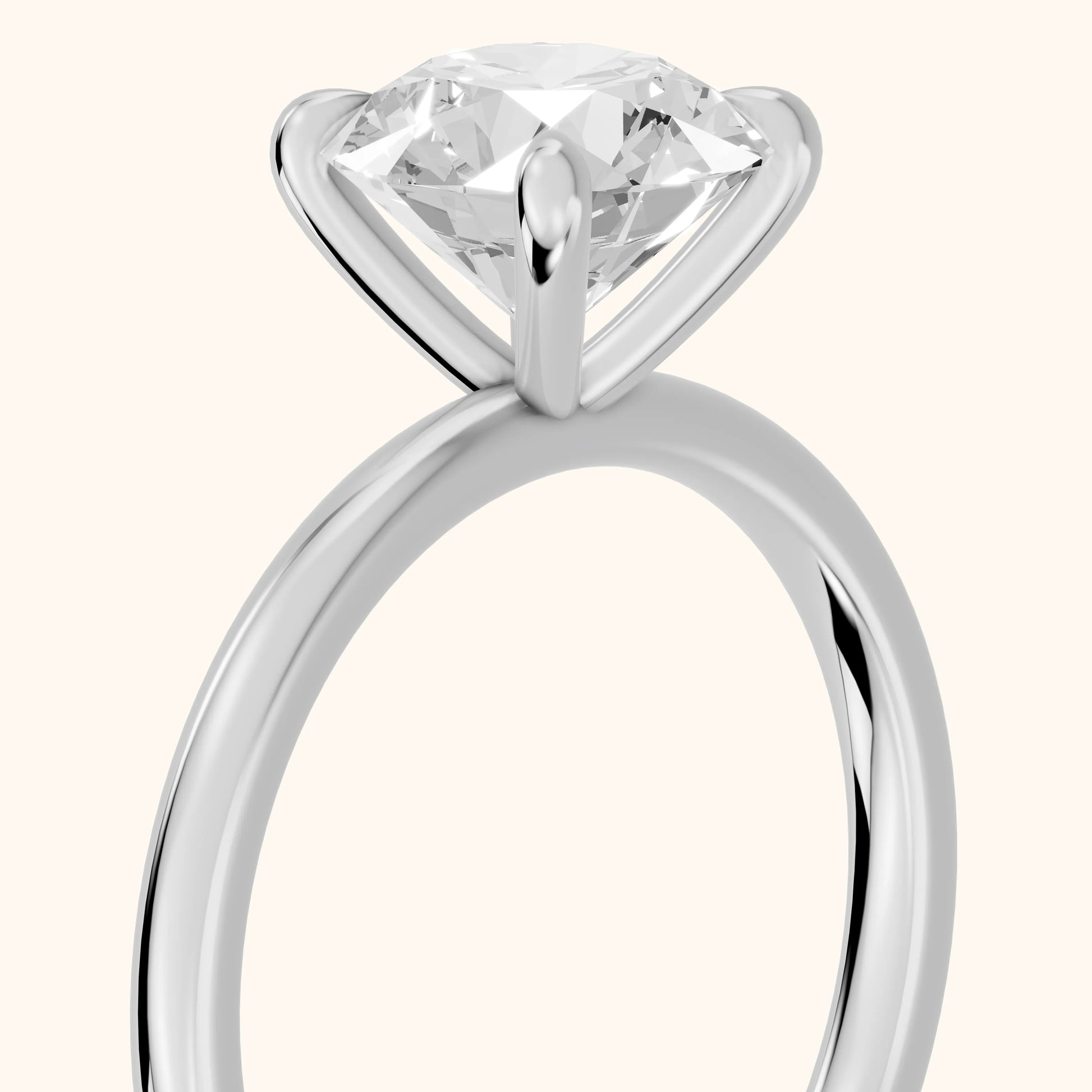 Nella Petite Solitaire Round Diamond Engagement Ring in Platinum - slant-view.webp