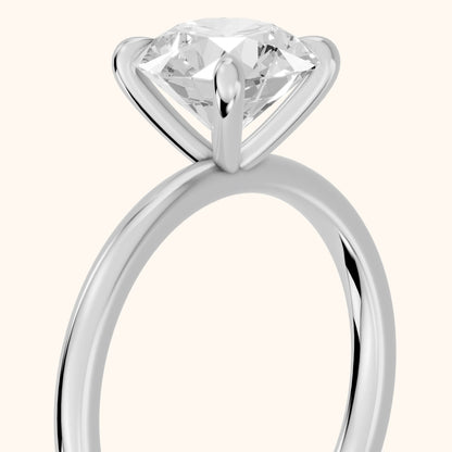 Nella Petite Solitaire Round Diamond Engagement Ring in Platinum - slant-view.webp