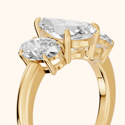 Lila Three-Stone Pear Diamond Ring in Yellow Gold - slant-view.webp