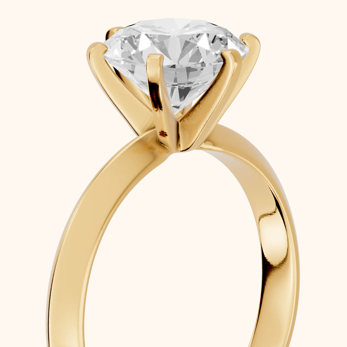 Hailey Solitaire Knife Edge Round Diamond Engagement Ring in Yellow Gold - slant-view.webp