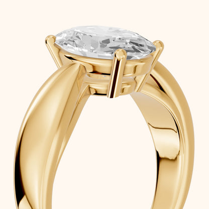 Talia Solitaire Twist Oval Diamond Engagement Ring in Yellow Gold - slant-view.webp