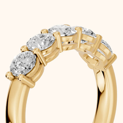 Theia Shared Prong Round Diamond Wedding Band in Yellow Gold - slant-view