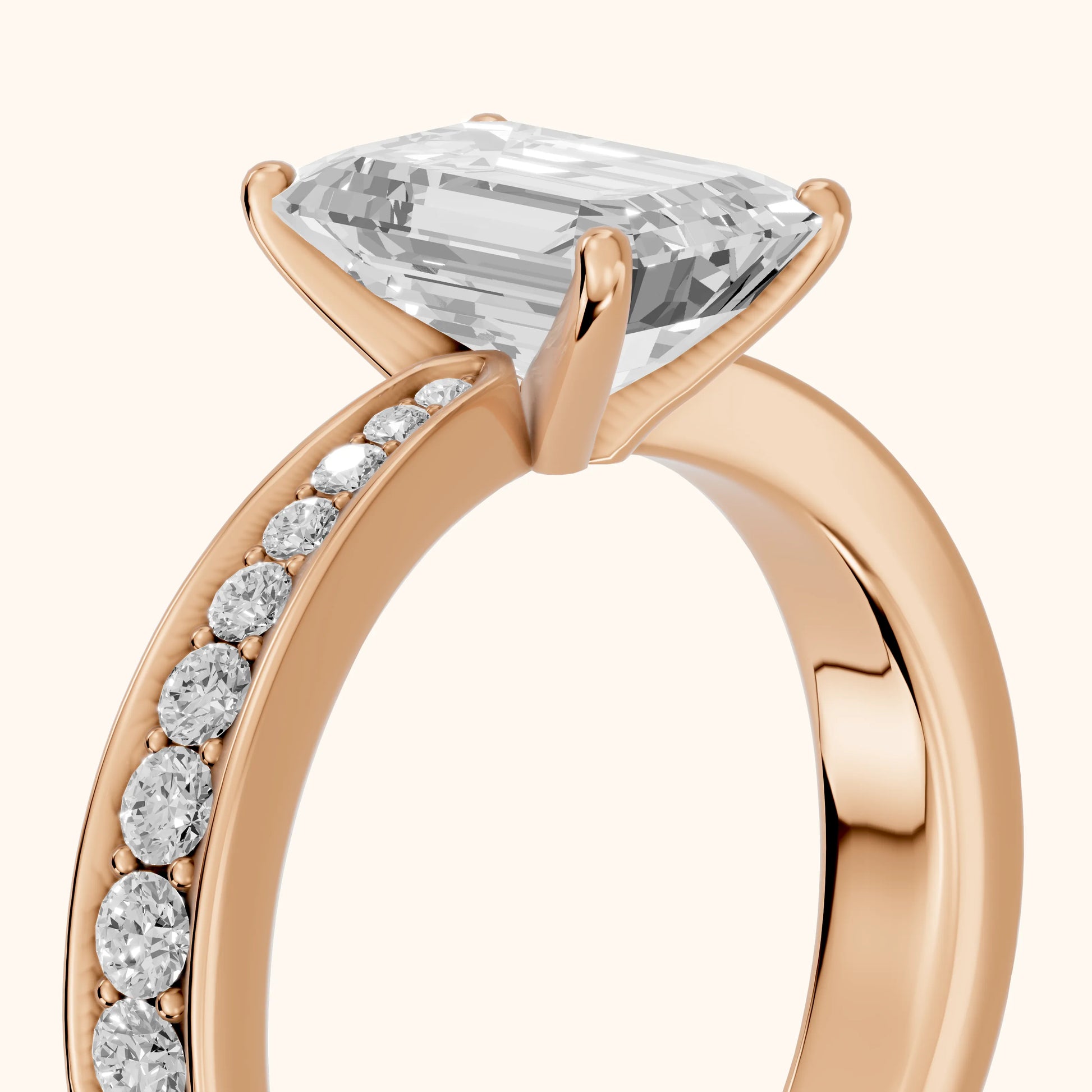 Rhea Sidestone Pavé Emerald Diamond Engagement Ring in Rose Gold - slant-view.webp