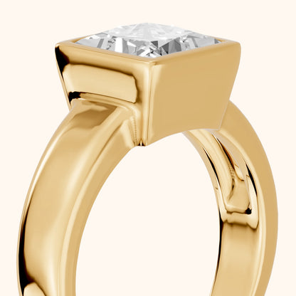 Ida Bezel Solitaire Princess Diamond Engagement Ring in Yellow Gold - slant-view.webp