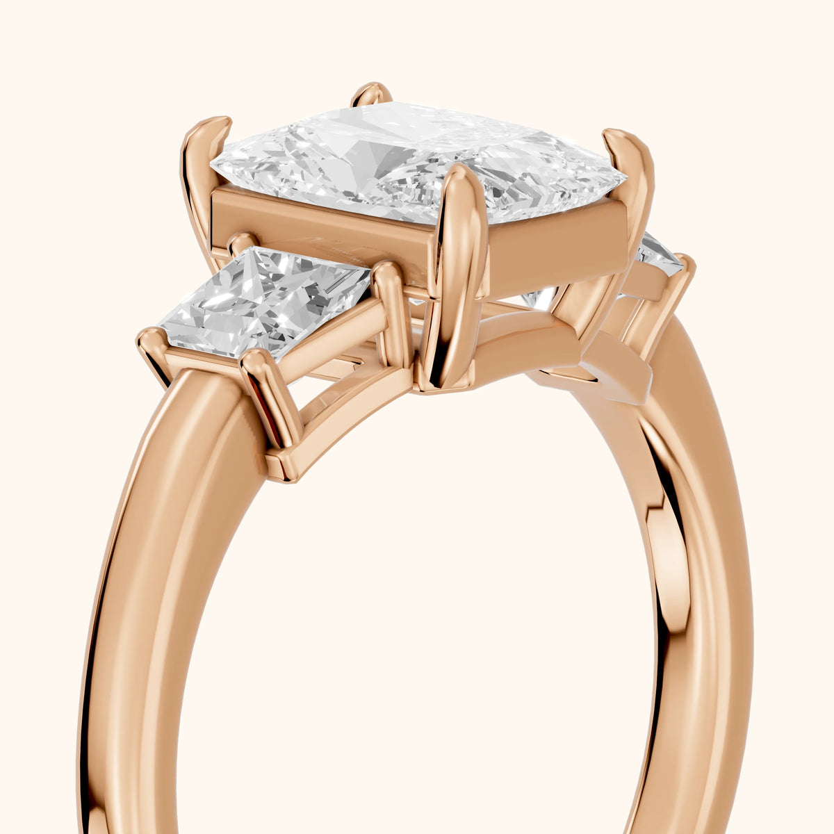 Aria Three-Stone Basket Radiant Diamond Engagement Ring in Rose Gold - slant-view.webp