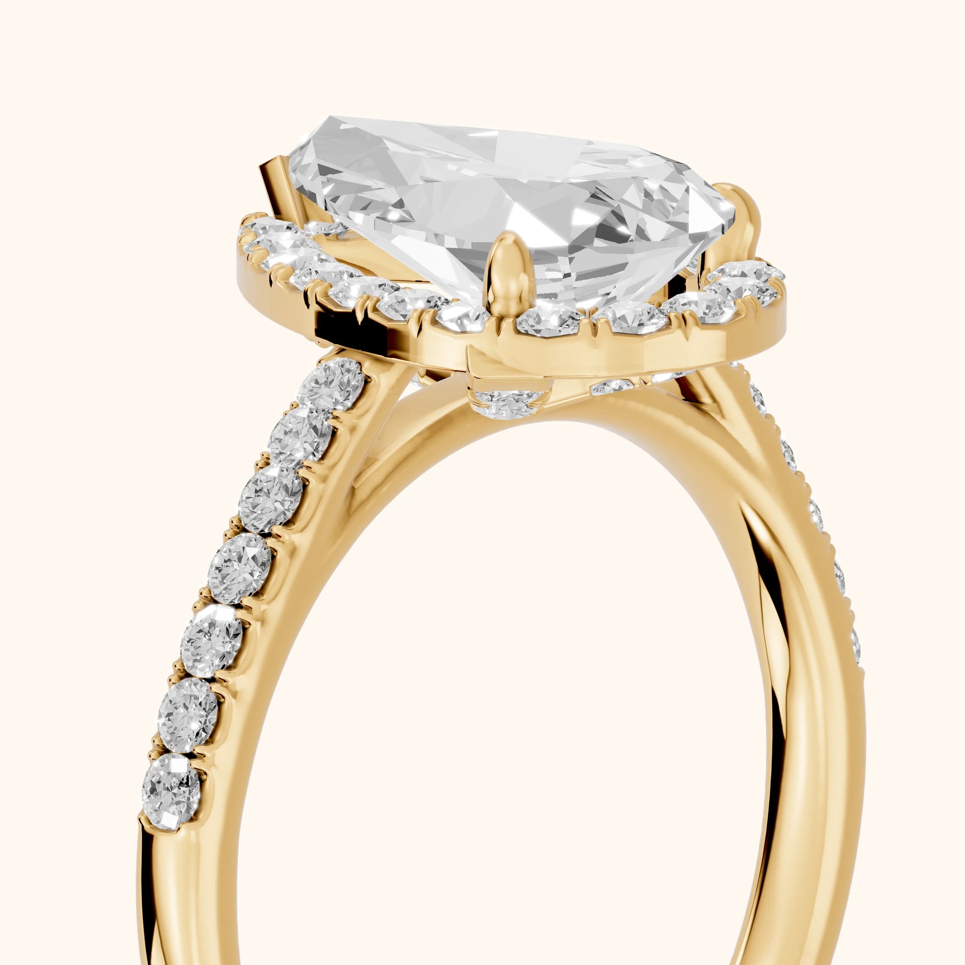 Alma Halo Pavé Pear Diamond Ring in Yellow Gold - slant-view.webp