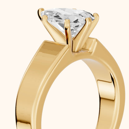 Susannah Wide Band Solitaire Pear Diamond Engagement Ring in Yellow Gold - slant-view.webp