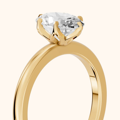 Serena Blossom Solitaire Oval Diamond Engagement Ring in Yellow Gold - slant-view.webp
