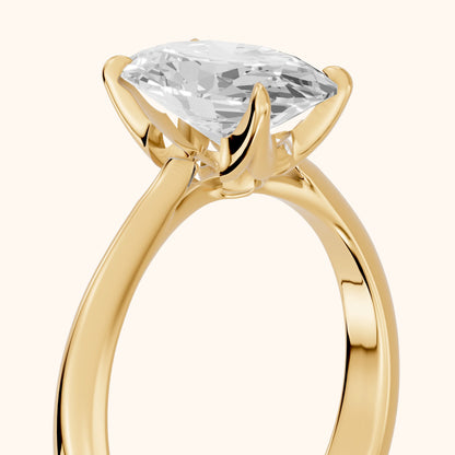 Evie Solitaire Six-Prong Oval Diamond Engagement Ring in Yellow Gold - slant-view.webp