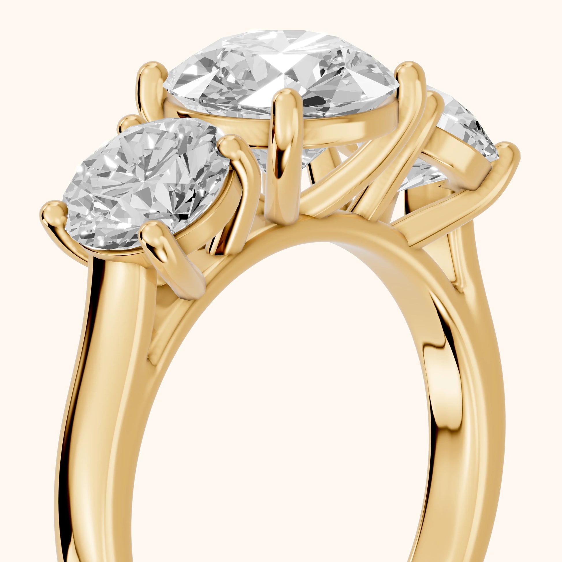 Esme Three-Stone Tapered Round Diamond Ring in Yellow Gold - slant-view.webp