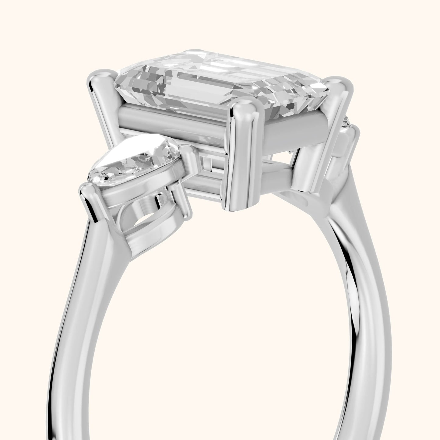Faye Three-Stone Trellis Emerald Diamond Ring in Platinum - slant-view.webp