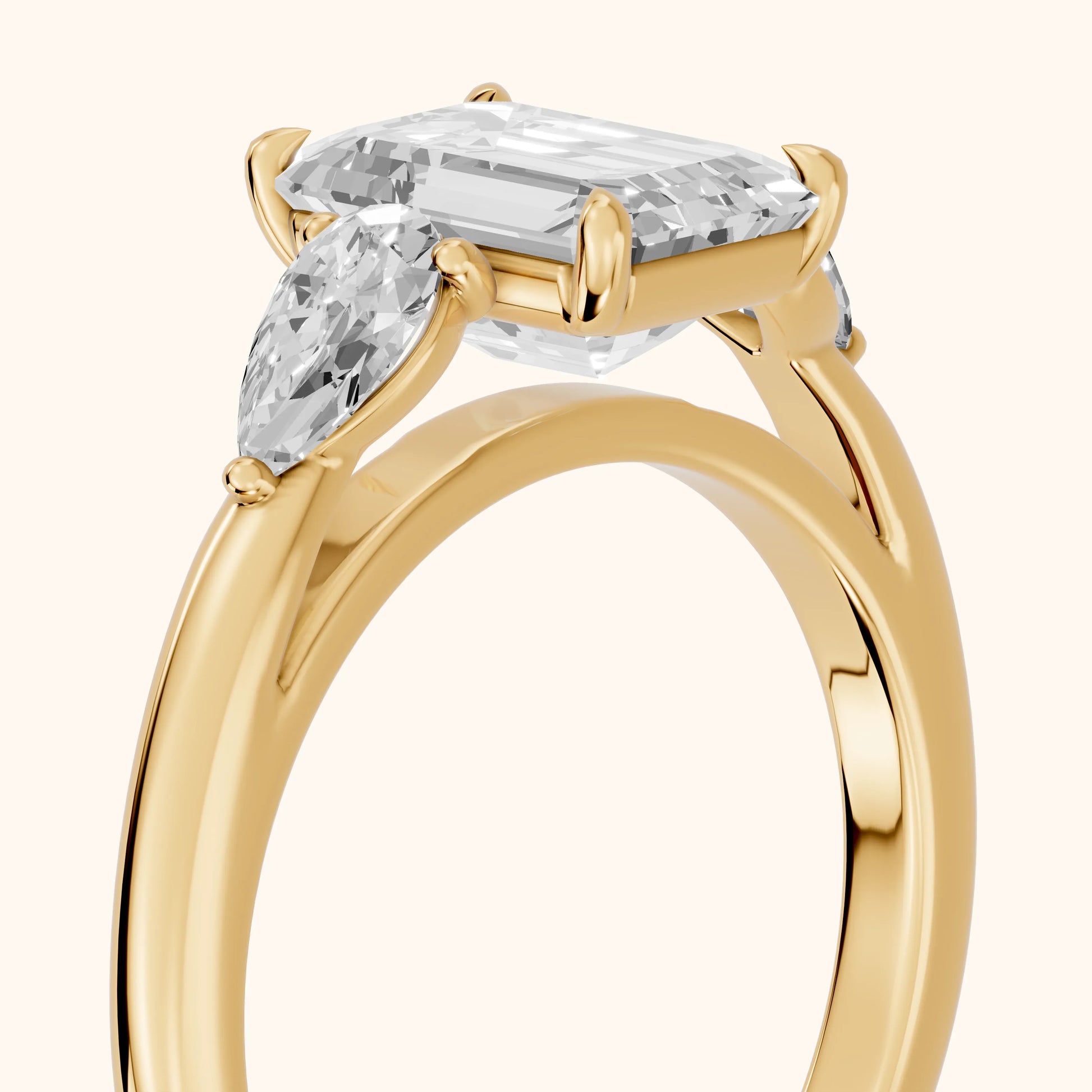 Phoebe Three-Stone Emerald Diamond Ring in Yellow Gold - slant-view.webp