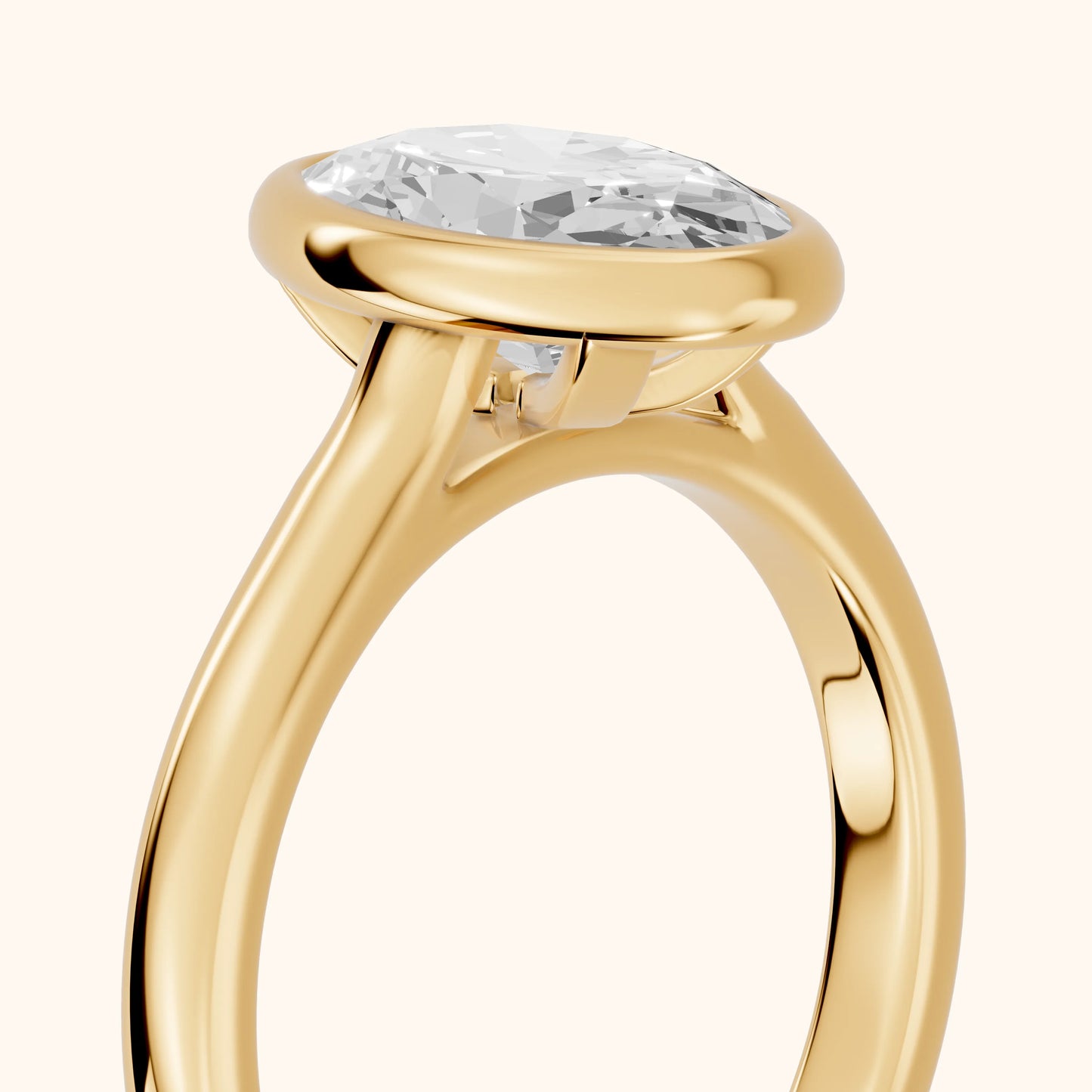 Jolie Bezel Solitaire Oval Diamond Engagement Ring in Yellow Gold - slant-view.webp