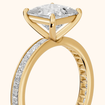 Brielle Channel Set Solitaire Princess Diamond Ring in Yellow Gold - slant-view.webp