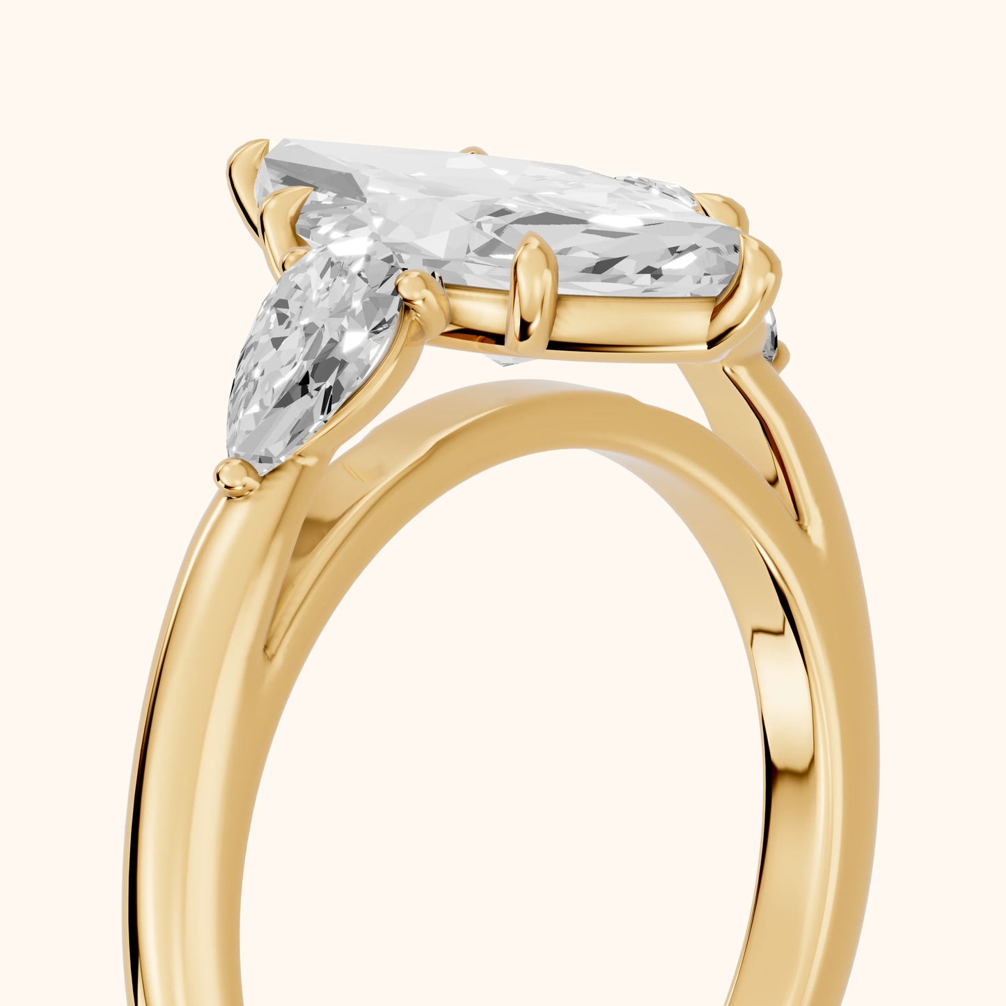 Phoebe Three-Stone Marquise Diamond Ring in Yellow Gold - slant-view.webp