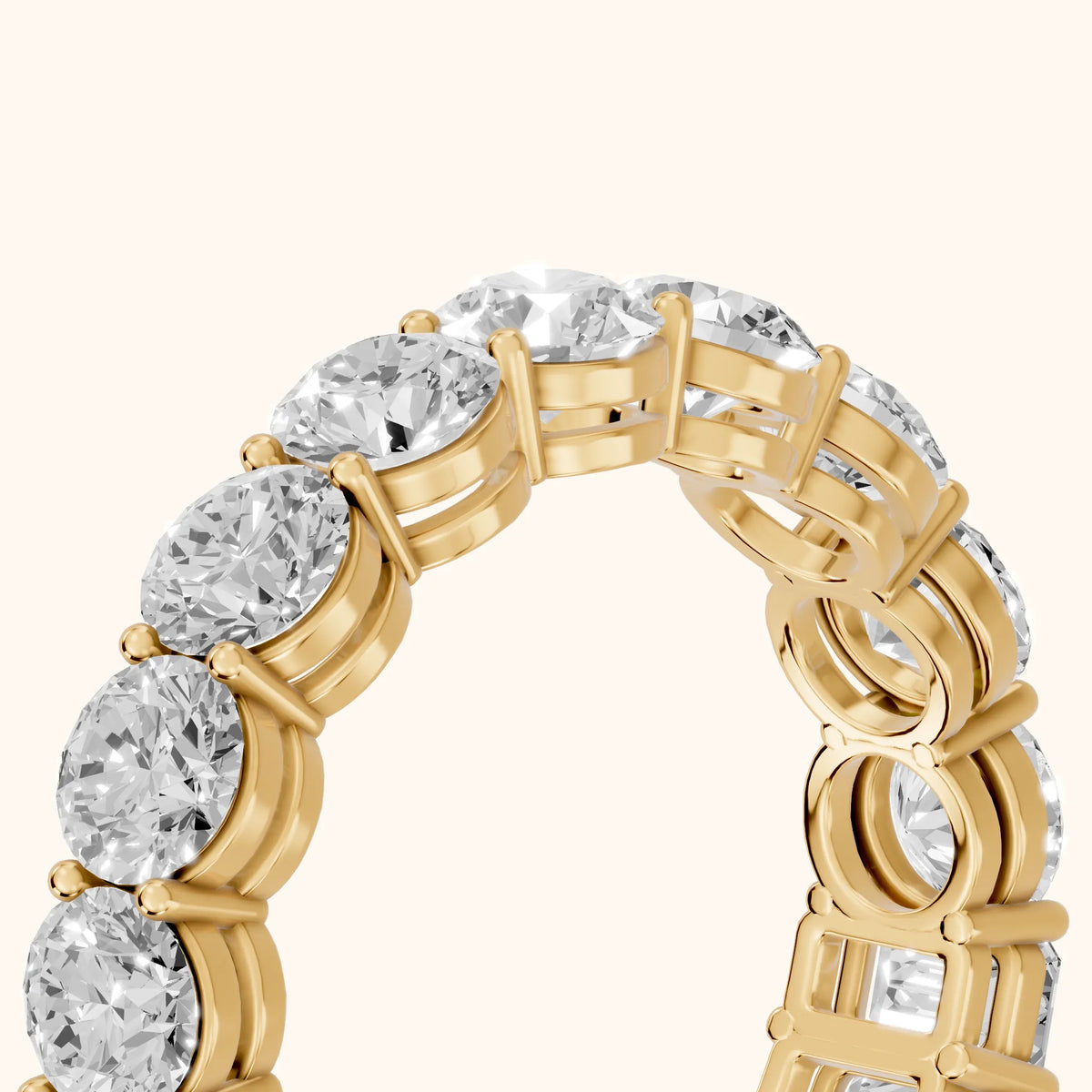 Malia Shared Prong Round & Emerald Diamond Eternity Band in Yellow Gold - slant-view