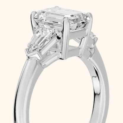 Dorothea Baguette Three-Stone Emerald Diamond Engagement Ring in Silver - slant-view.webp