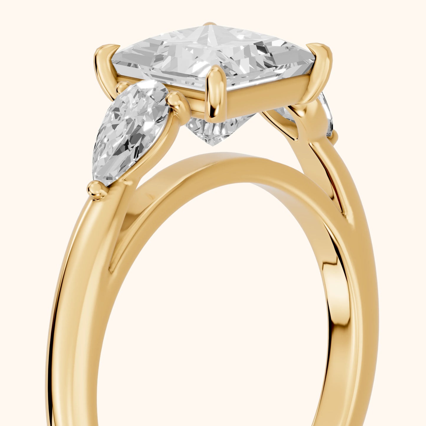 Phoebe Three-Stone Princess Diamond Ring in Yellow Gold - slant-view.webp