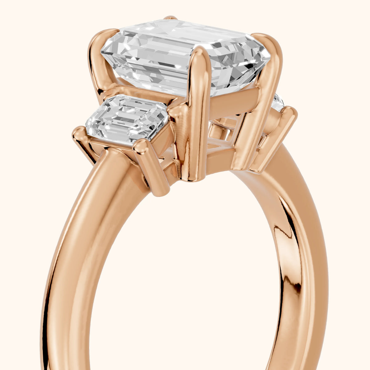 Babette Deco Three-Stone Emerald Diamond Engagement Ring in Rose Gold - slant-view.webp