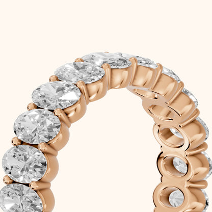 Vidya Shared Prong Oval Diamond Eternity Band in Rose Gold - slant-view