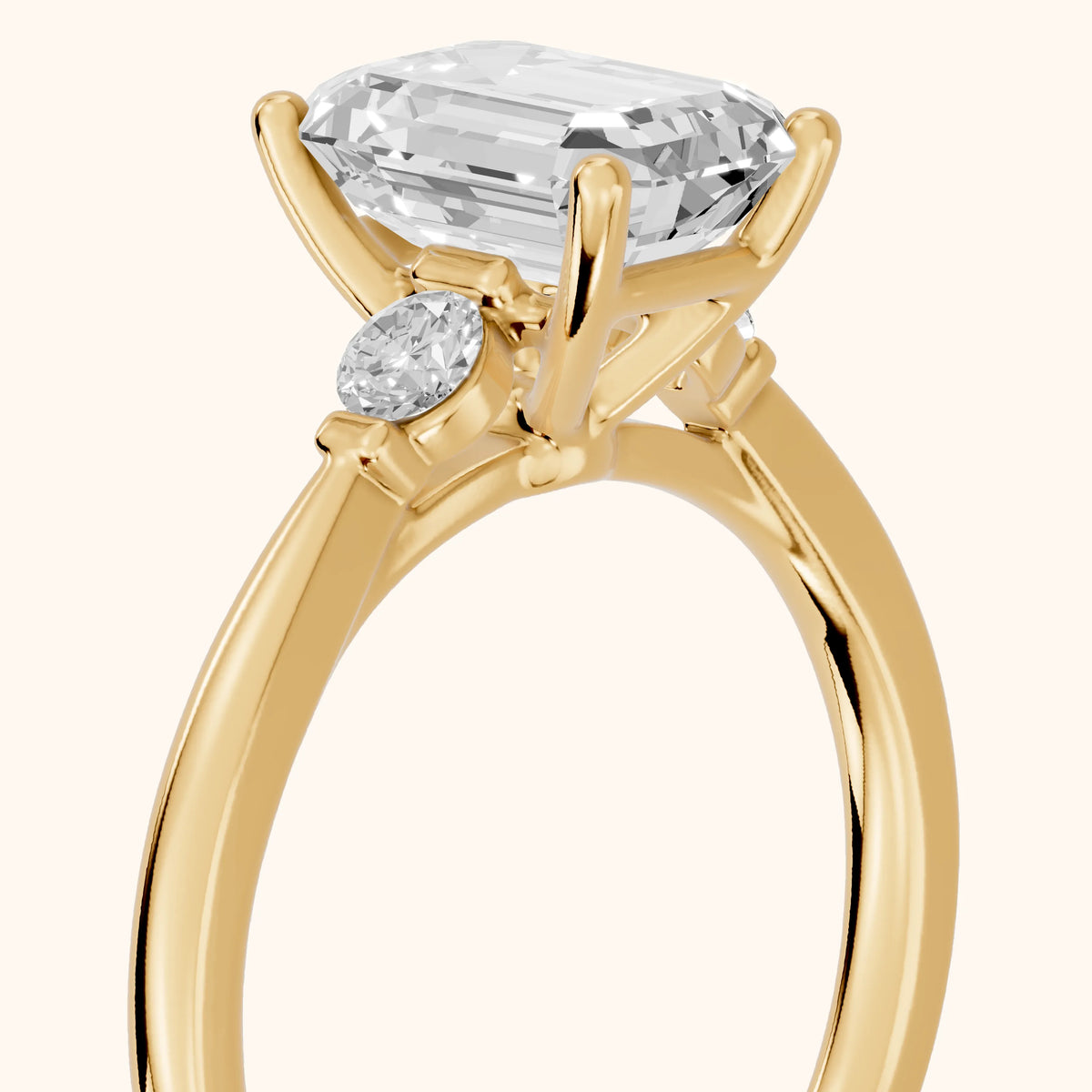 Micaela Three-Stone Emerald Diamond Engagement Ring in Yellow Gold - slant-view.webp