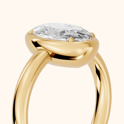 Alina Bezel Solitaire Oval Diamond Ring in Yellow Gold - slant-view.webp