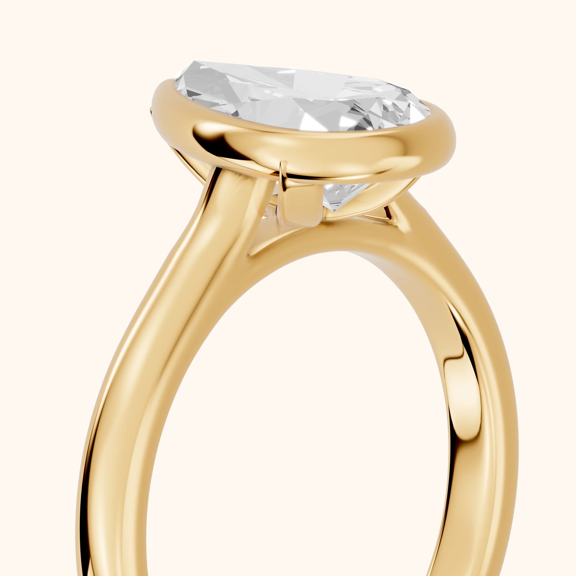 Jolie Bezel Solitaire Pear Diamond Engagement Ring in Yellow Gold - slant-view.webp