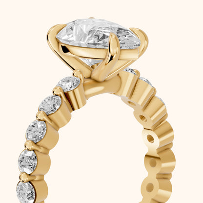 Piper Sidestone Pear Diamond Engagement Ring in Yellow Gold - slant-view.webp