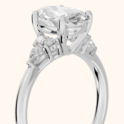 Zelie Pear-Side Cluster Oval Diamond Engagement Ring in Platinum - slant-view.webp