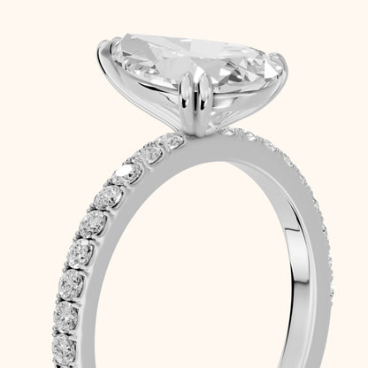 Novara Solitaire Pavé Pear Diamond Ring in White Gold - slant-view.webp