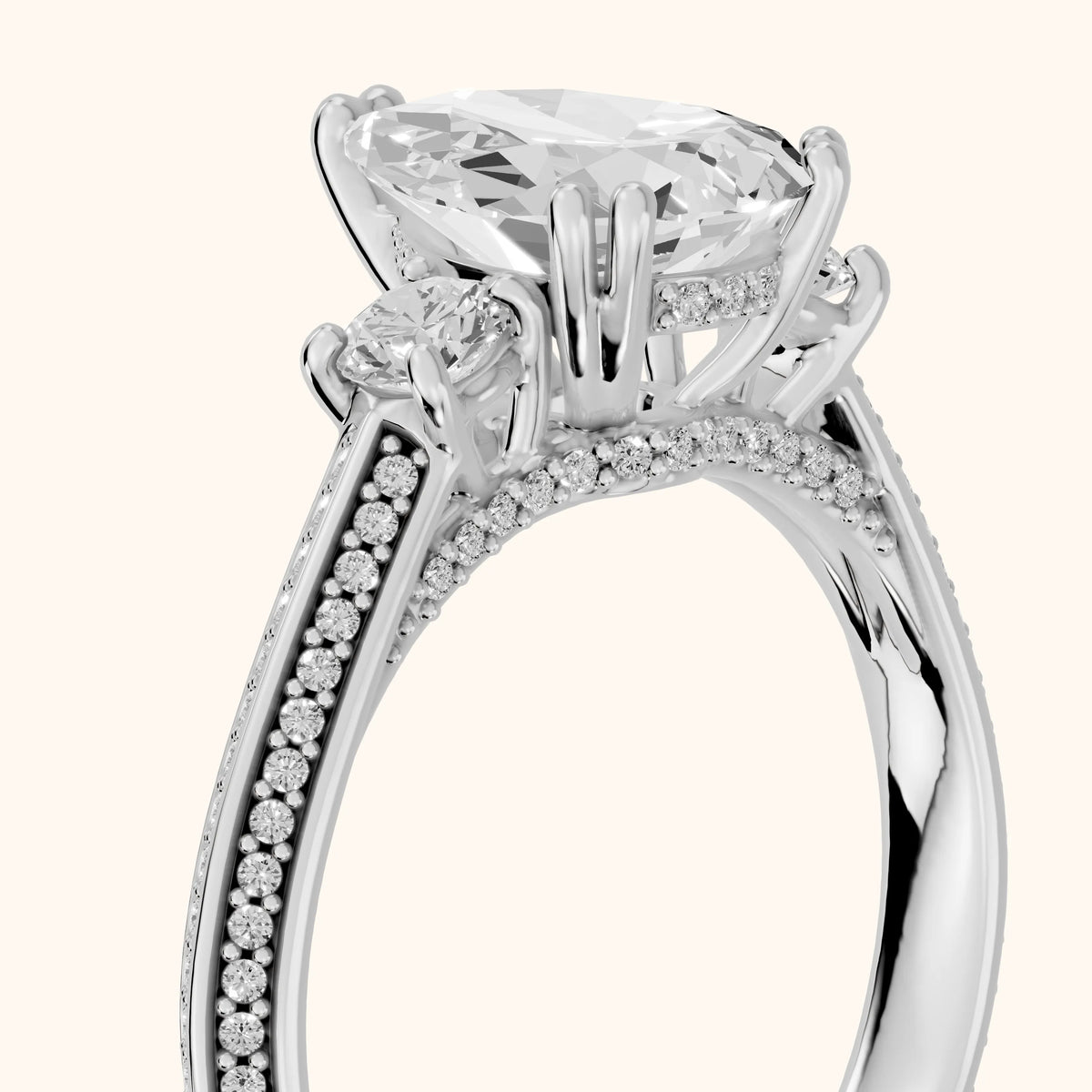 Aspen Three-Stone Knife Edge Pear Diamond Engagement Ring in Platinum - slant-view.webp