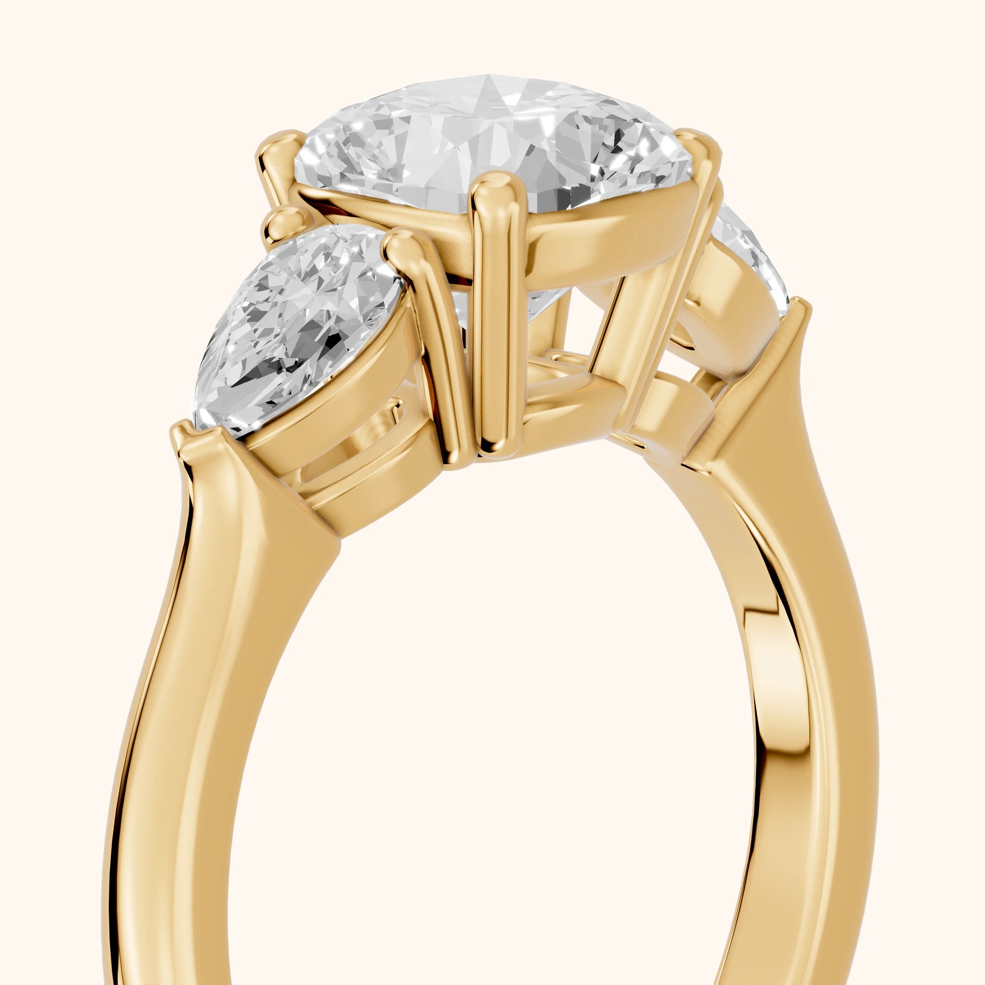 Mirabel Three-Stone Cushion Diamond Engagement Ring in Yellow Gold - slant-view.webp