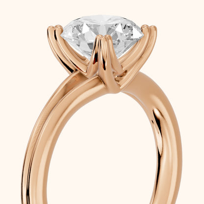 Neve Solitaire Split Shank Round Diamond Engagement Ring in Rose Gold - slant-view.webp