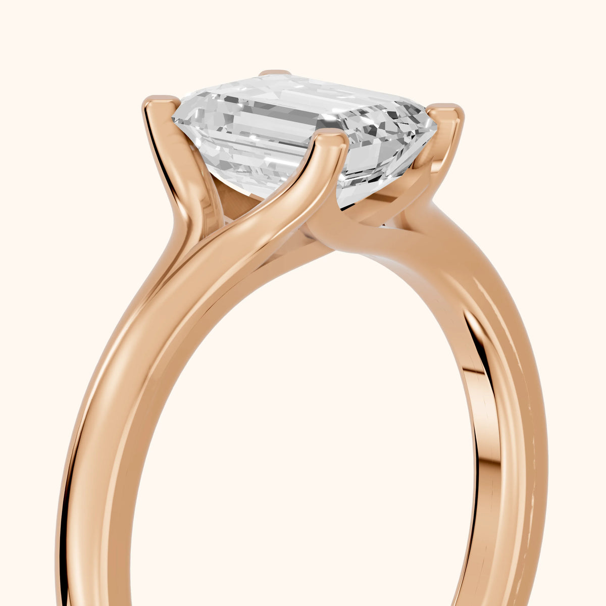 Nell Split Shank Solitaire Emerald Diamond Engagement Ring in Rose Gold - slant-view.webp