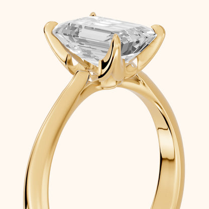 Evie Solitaire Six-Prong Emerald Diamond Engagement Ring in Yellow Gold - slant-view.webp