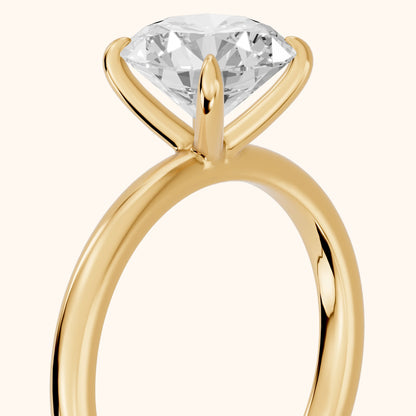 Susan Solitaire Round Diamond Engagement Ring in Yellow Gold - slant-view.webp