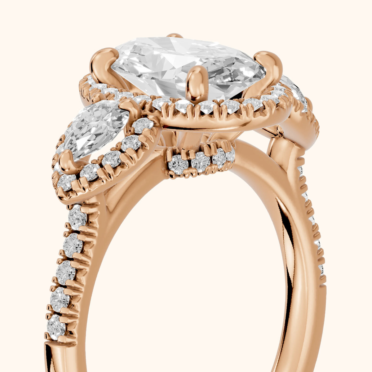 Camden Three-Stone Halo Oval Diamond Engagement Ring in Rose Gold - slant-view.webp