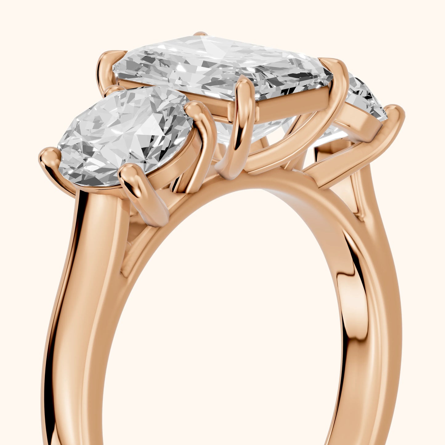 Esme Three-Stone Tapered Emerald Diamond Ring in Rose Gold - slant-view.webp