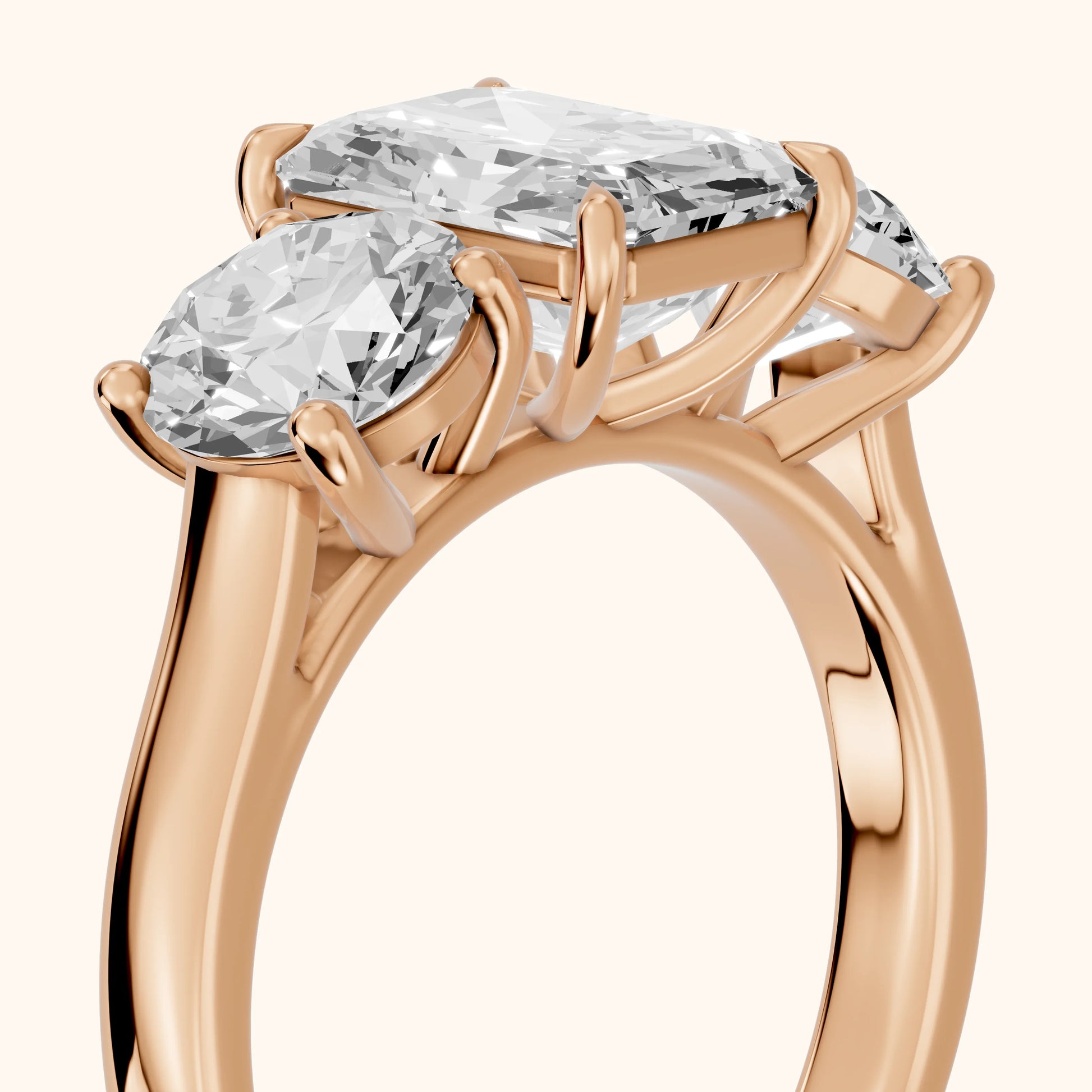 Esme Three-Stone Tapered Emerald Diamond Ring in Rose Gold - slant-view.webp
