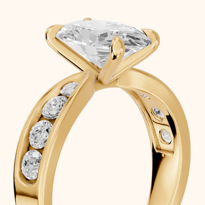Noor Channel Set Sidestone Oval Diamond Engagement Ring in Yellow Gold - slant-view.webp